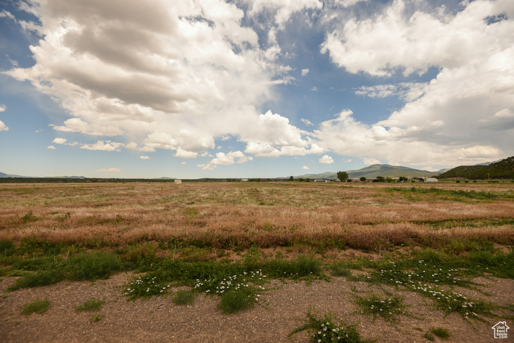 View of local wilderness featuring rural landscape and a mountain backdrop