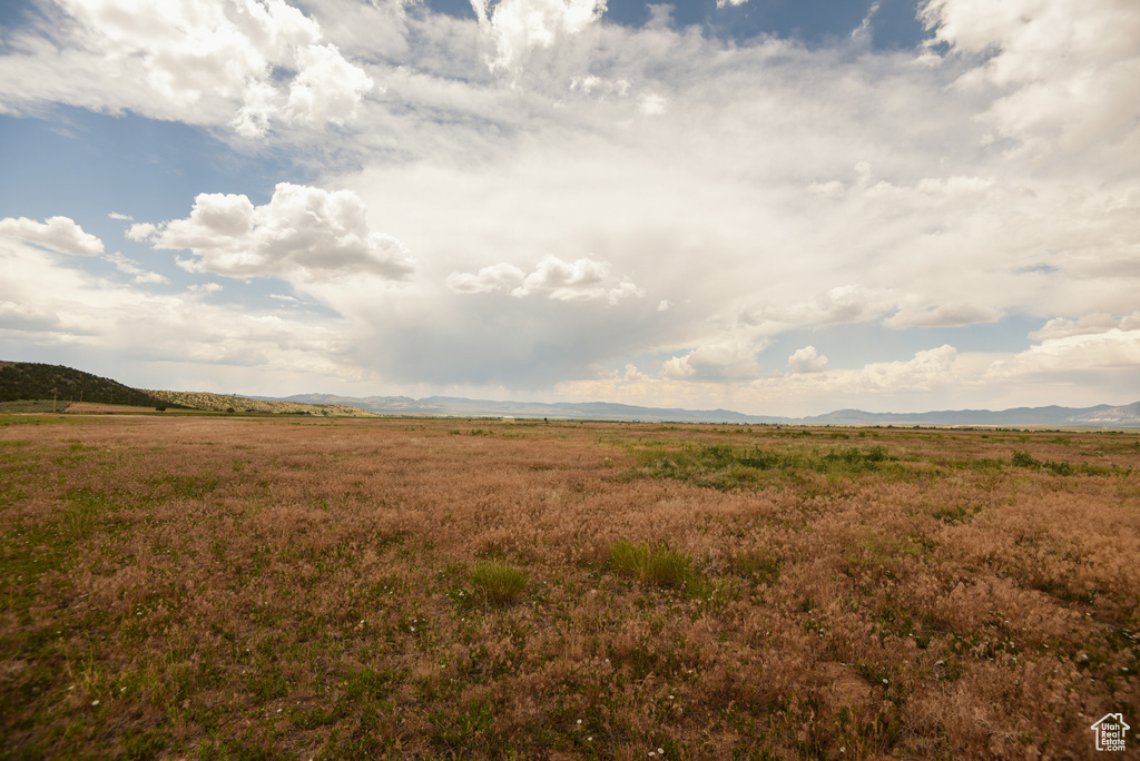 View of undeveloped land featuring rural landscape and mountains