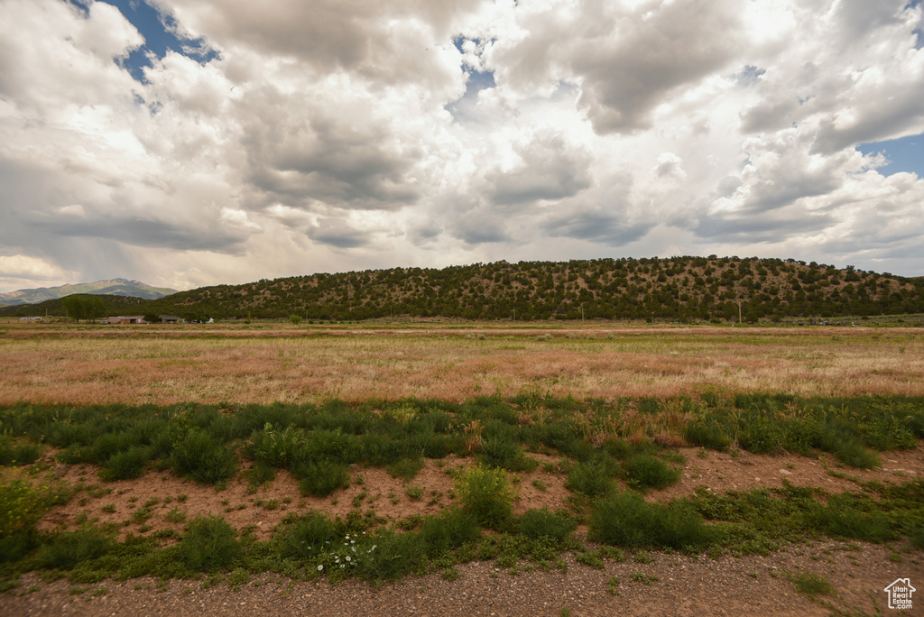 View of mountain background featuring rural landscape
