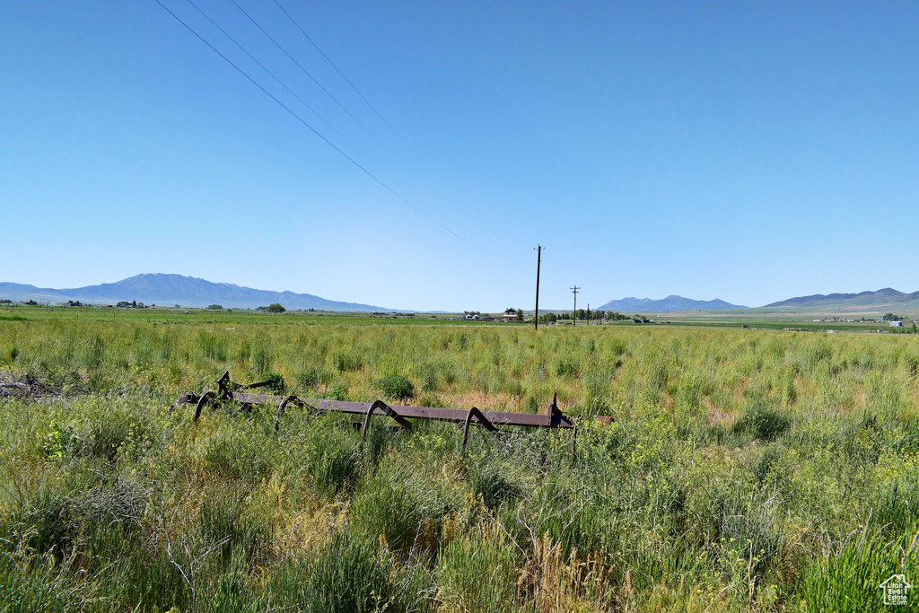 Property view of mountains with a rural view