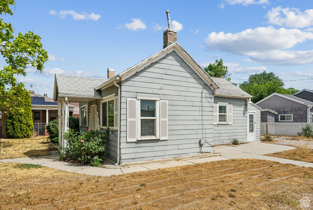 View of property exterior with solar panels