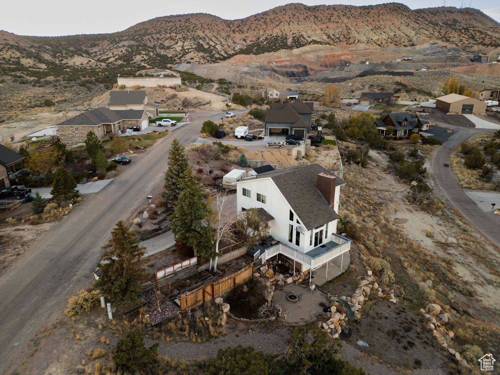 Birds eye view of property with a mountain view