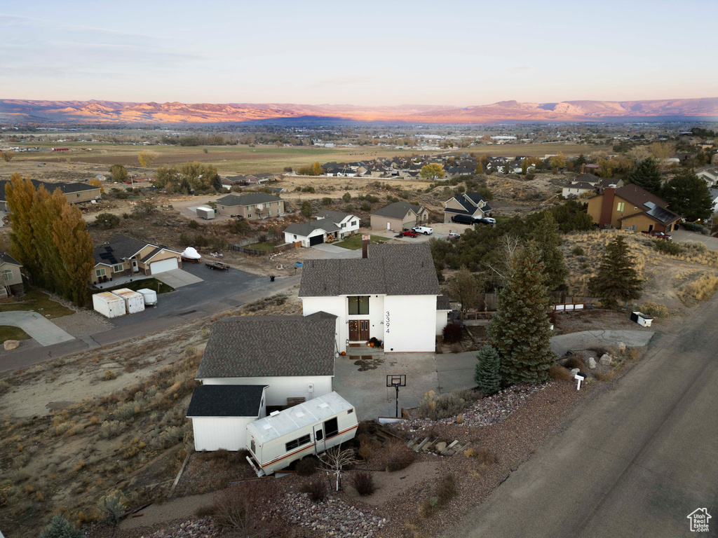 Aerial view at dusk featuring a mountain view