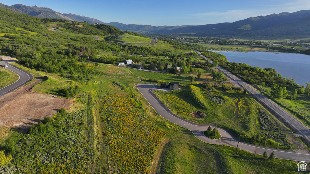 View of property location featuring a water and mountain view