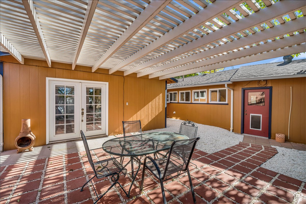 View of patio with french doors and a pergola