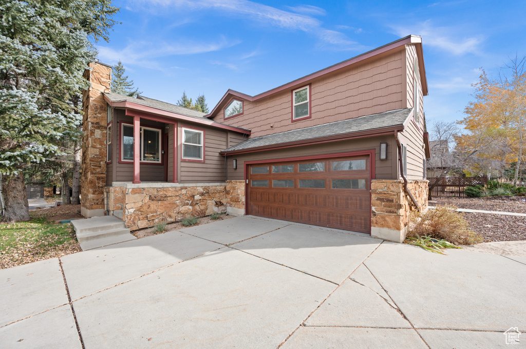 View of front of property with a garage