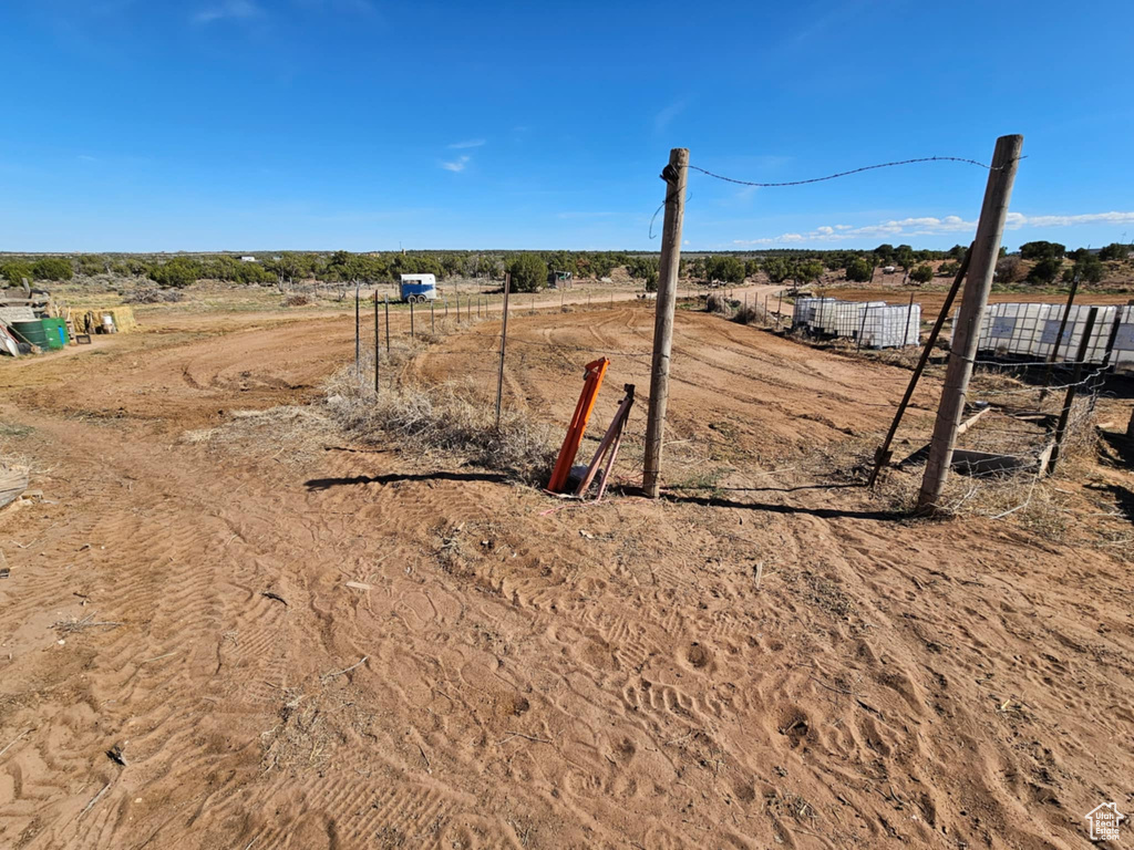 View of yard featuring a rural view and fence