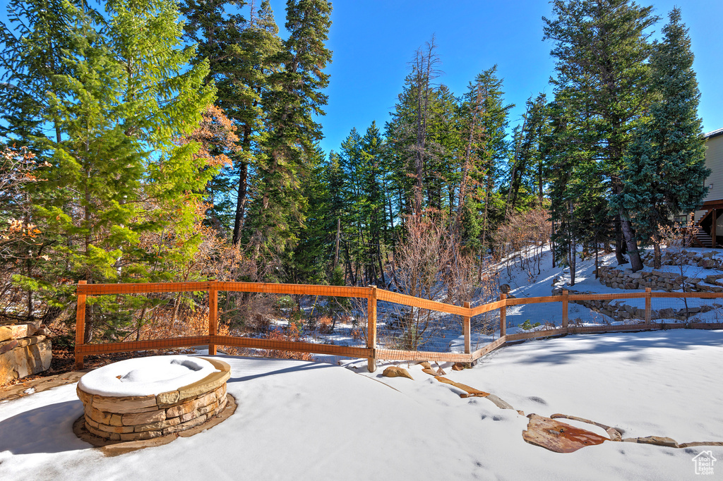 Exterior space with an outdoor fire pit