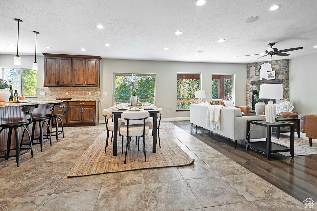 Dining room featuring a textured ceiling and ceiling fan