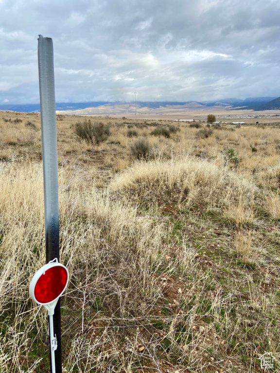 Property view of water featuring a rural view and a mountain view