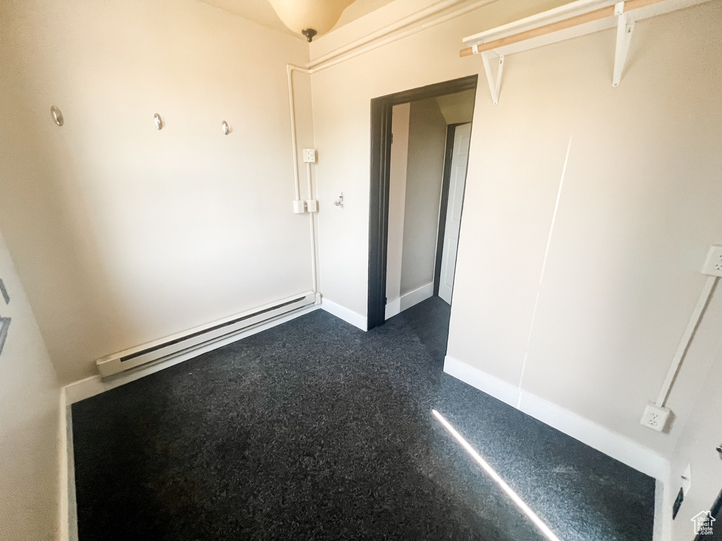 Unfurnished bedroom with baseboard heating