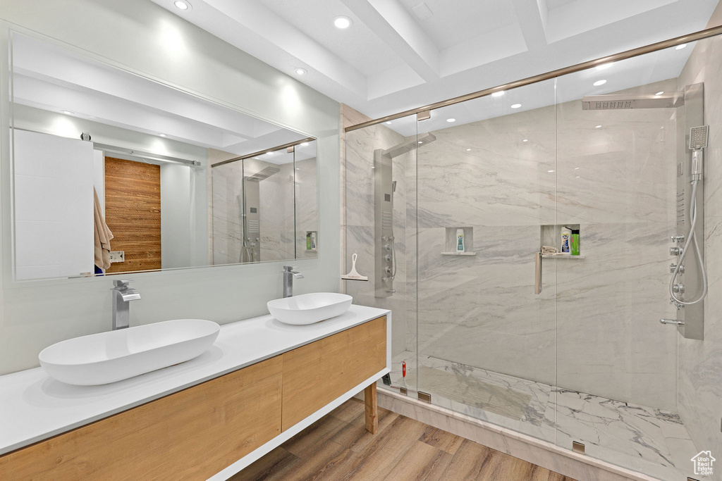 Bathroom featuring beamed ceiling, wood-type flooring, vanity, and walk in shower