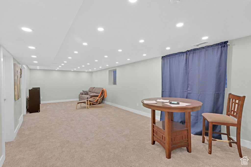 Living area with light colored carpet