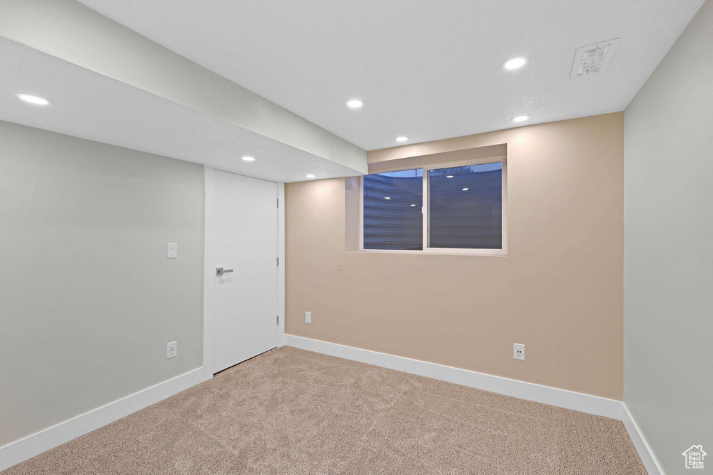 Basement featuring carpet flooring