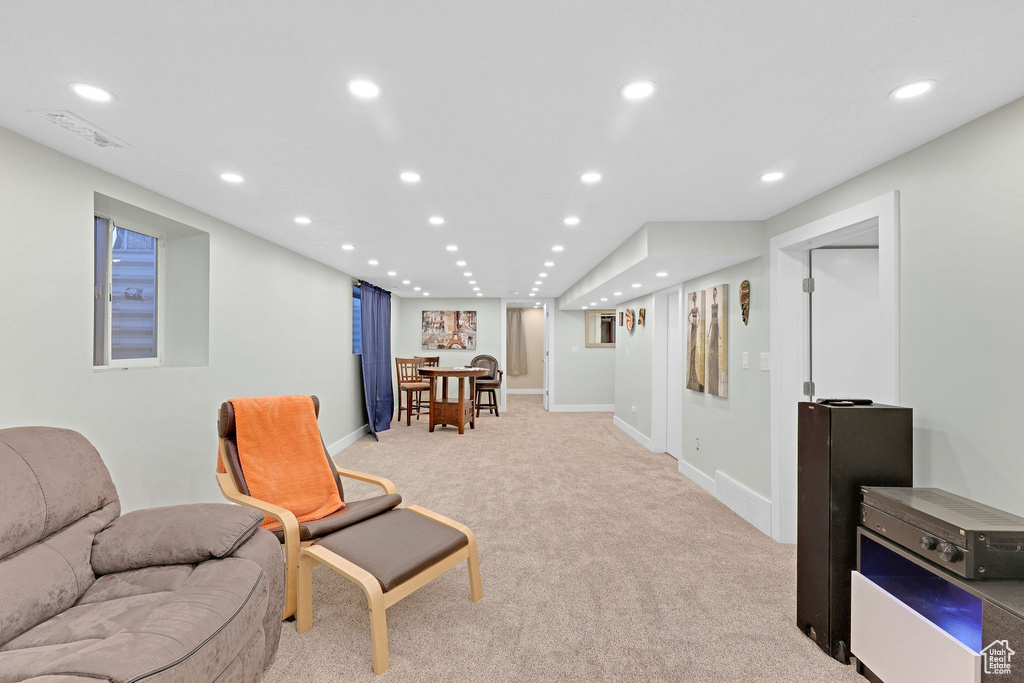 Living area featuring light colored carpet