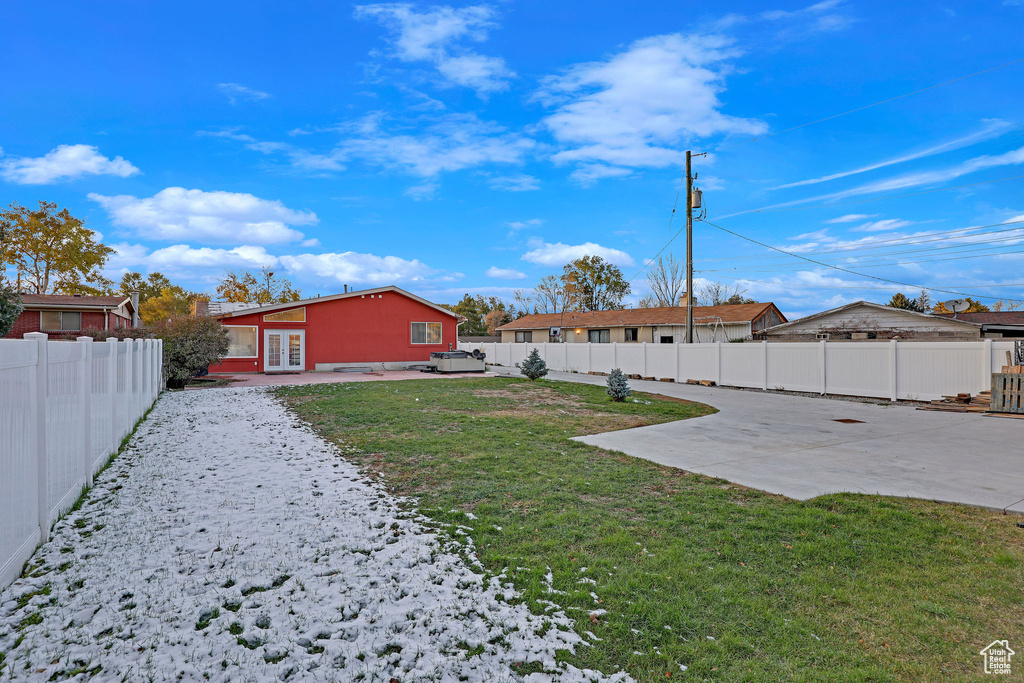 View of yard with a patio area, french doors, and a hot tub