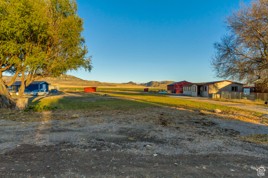 View of yard with a mountain view and an outdoor structure