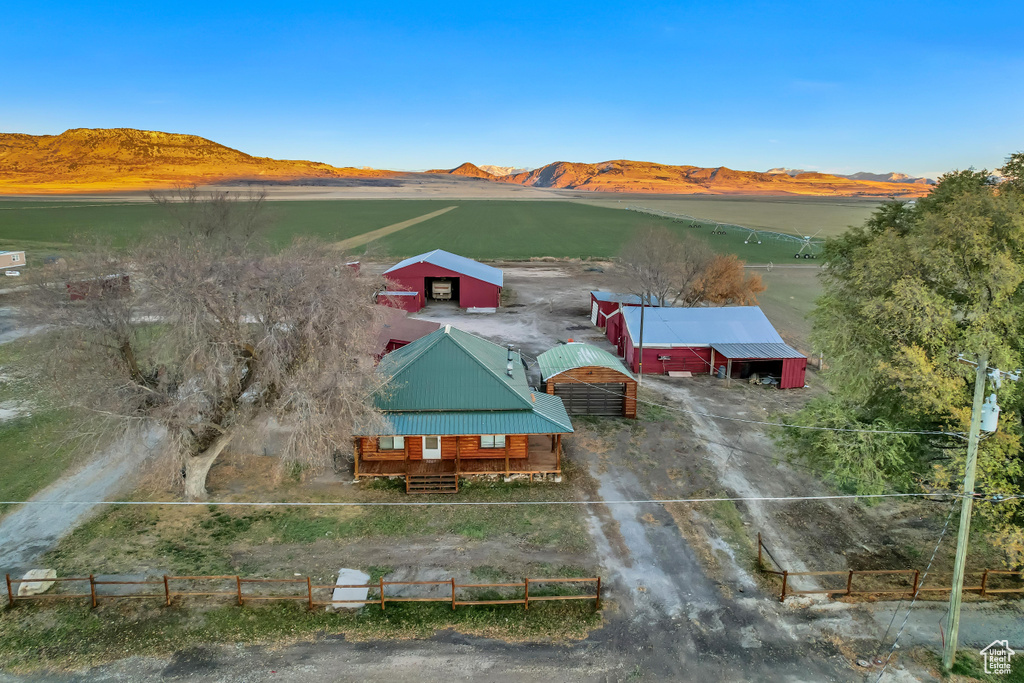 Birds eye view of property with a mountain view and a rural view