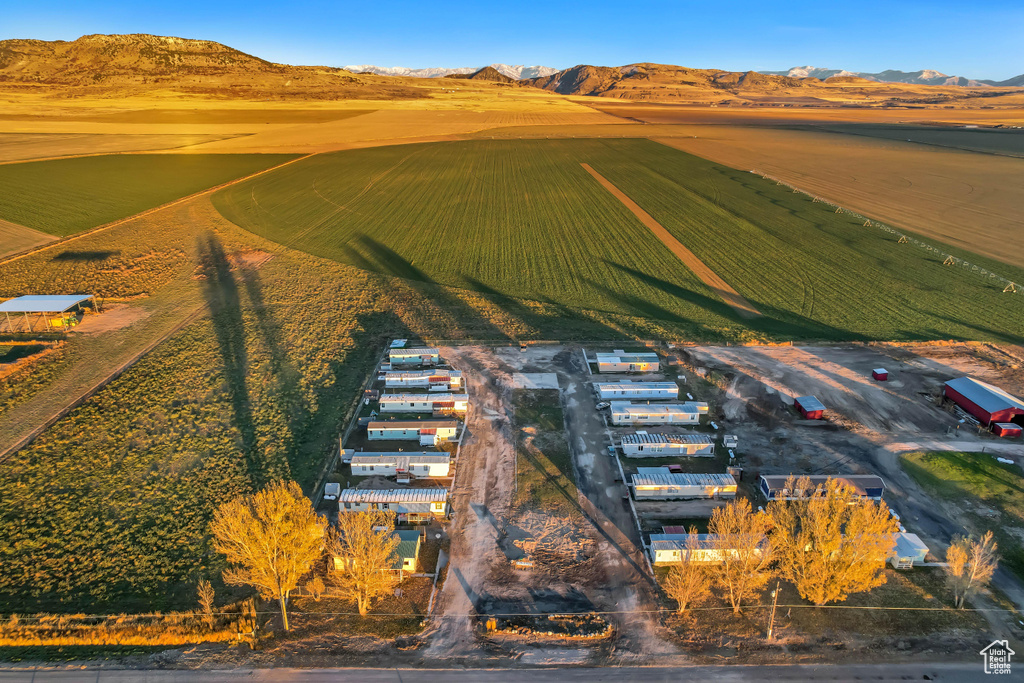 Birds eye view of property with a mountain view and a rural view