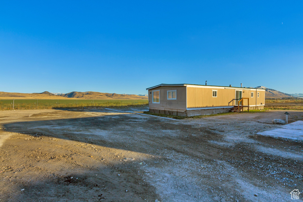 Exterior space with a mountain view and a rural view