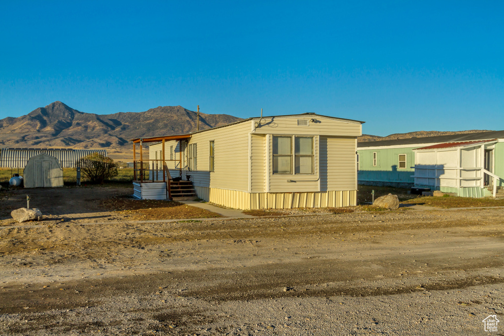 View of front of property with a mountain view