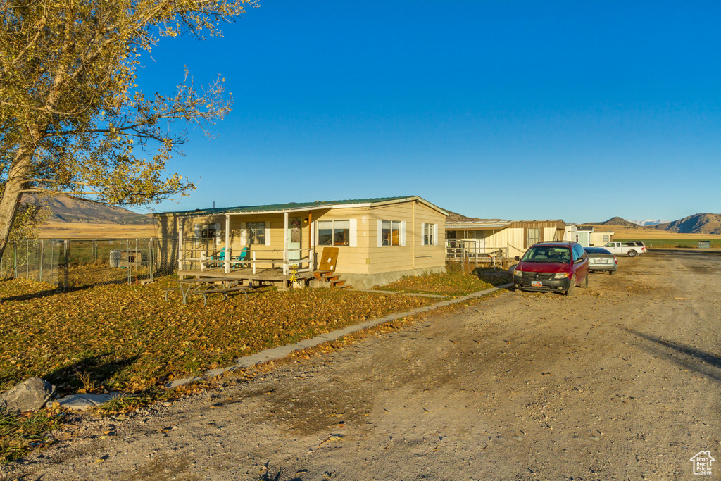 View of front facade with a mountain view and a porch