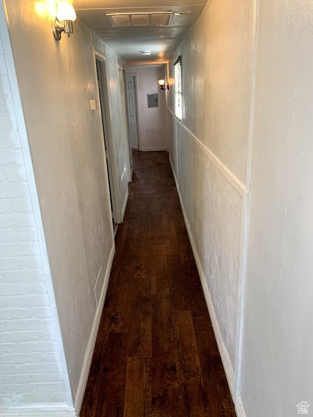 Hallway featuring dark hardwood / wood-style floors