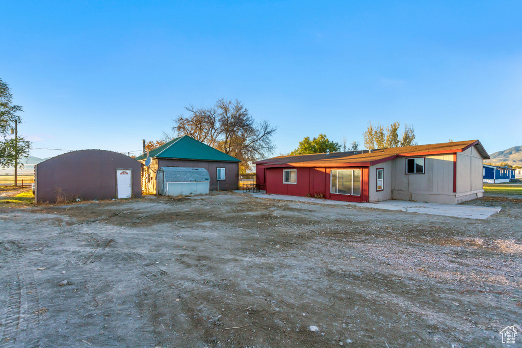 View of front of property featuring an outbuilding