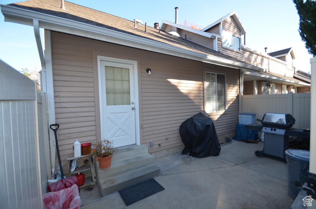 Rear view of house featuring a patio