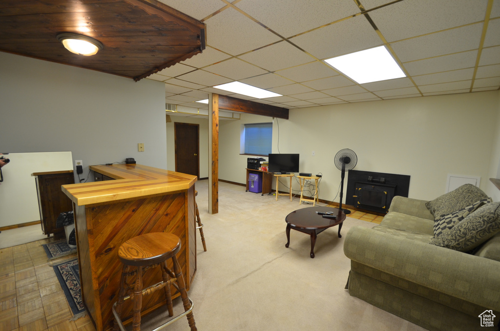 Living room with a paneled ceiling