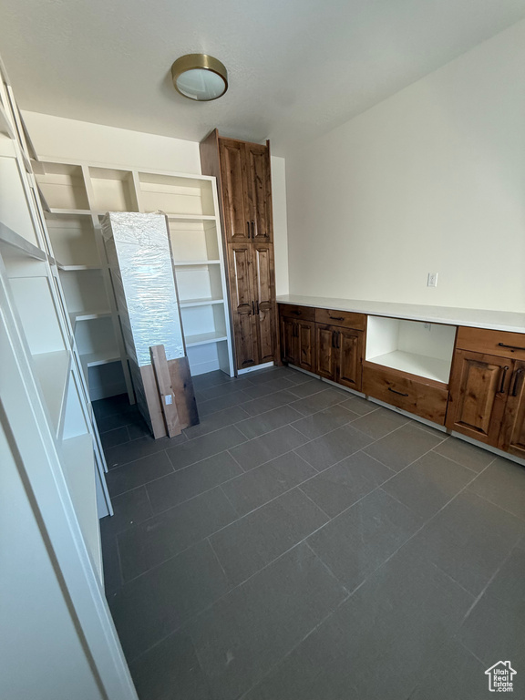 Interior space with dark tile patterned flooring