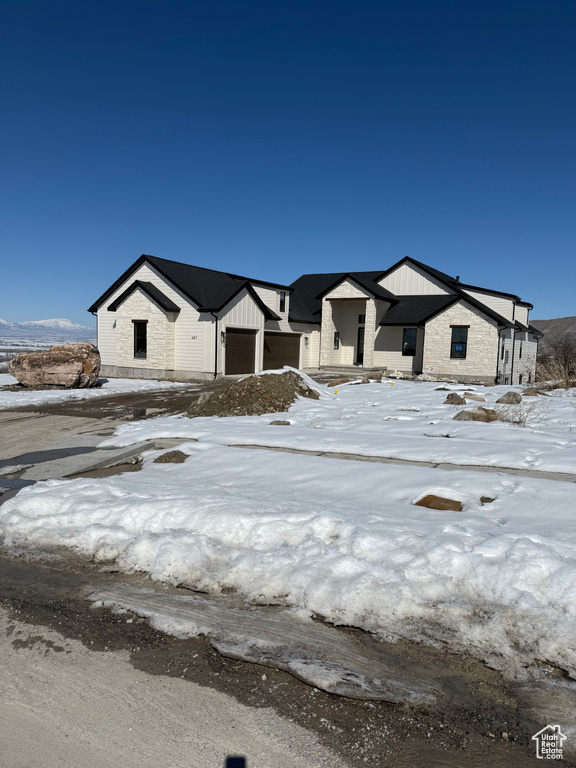 Modern farmhouse with a garage and board and batten siding