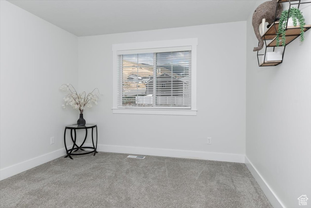 Empty room featuring carpet floors