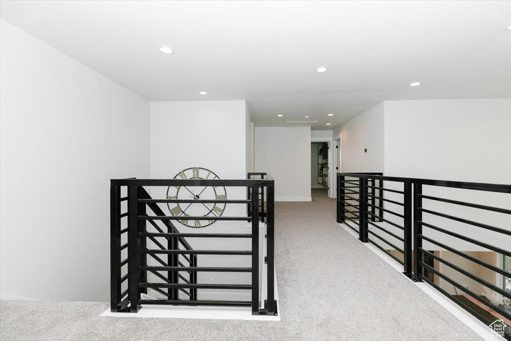 Hallway with light colored carpet