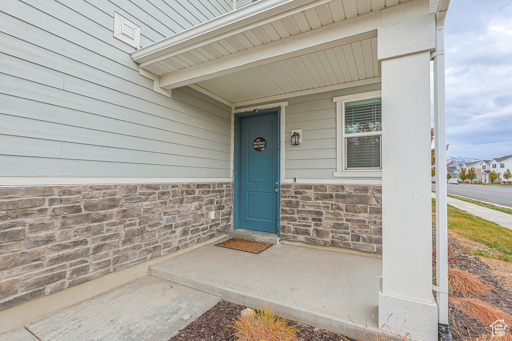 Property entrance with covered porch