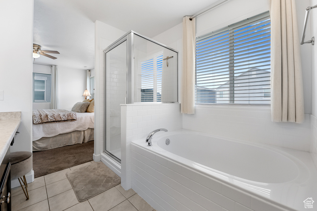 Bathroom with separate shower and tub, ceiling fan, tile patterned flooring, and vanity