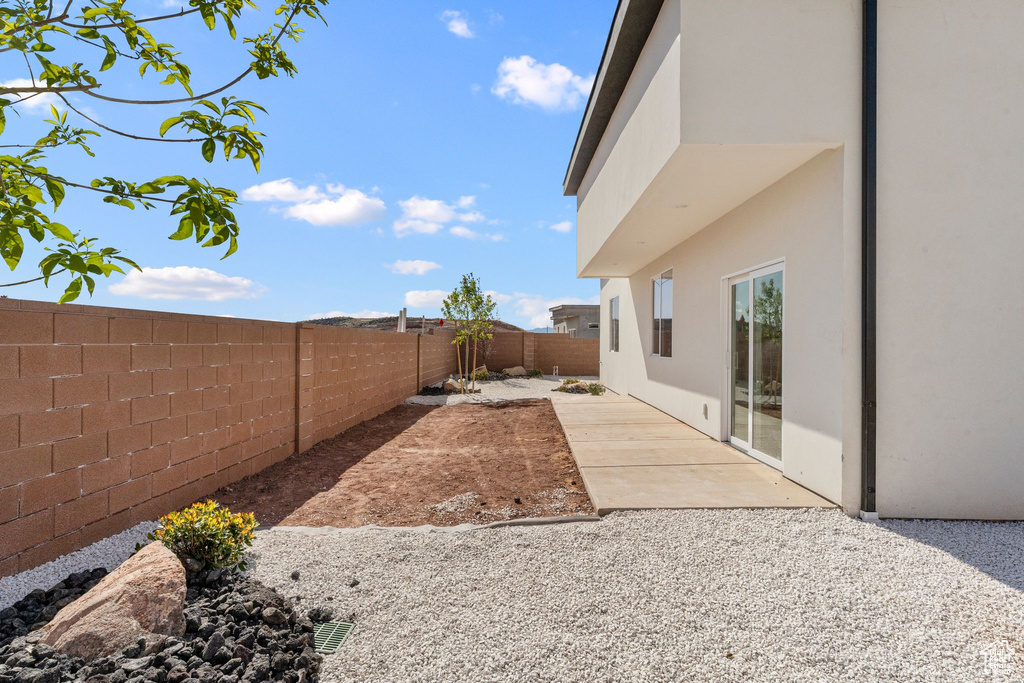 View of yard with a patio and a fenced backyard