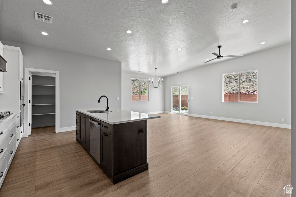 Kitchen with visible vents, a sink, light countertops, recessed lighting, and stainless steel dishwasher