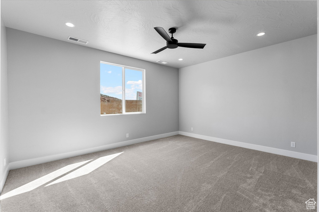Spare room with visible vents, ceiling fan, recessed lighting, and carpet floors