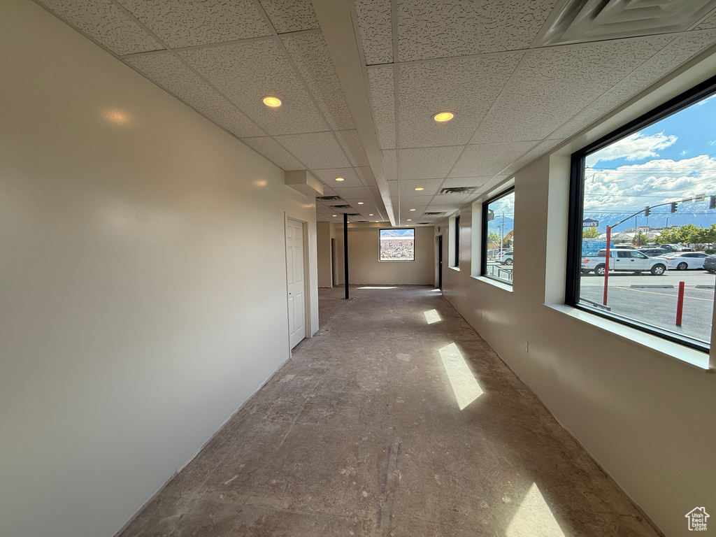 Corridor featuring recessed lighting, a paneled ceiling, and visible vents