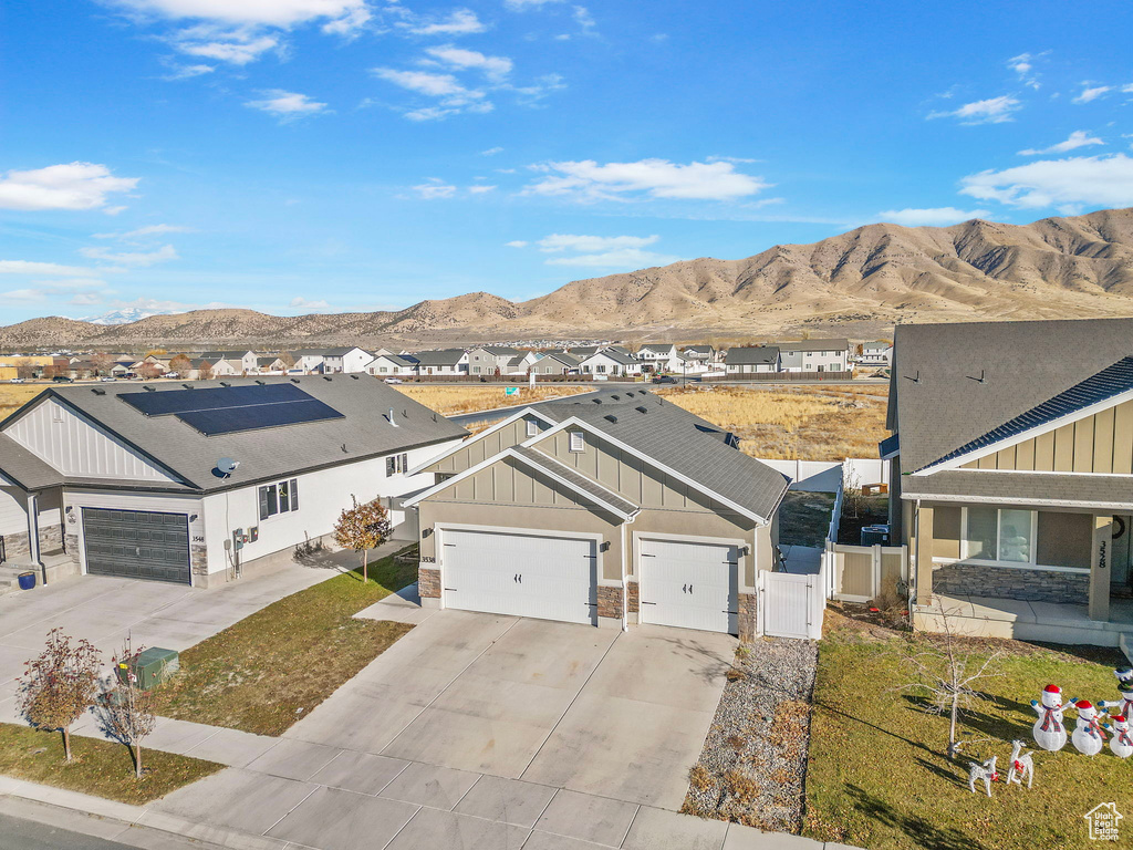 Exterior space featuring a mountain view and a garage