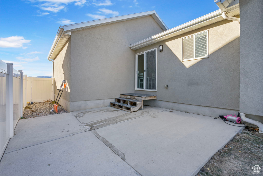 Back of property featuring a patio area