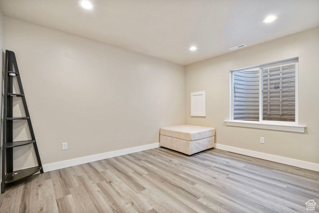 Unfurnished room with light wood-type flooring