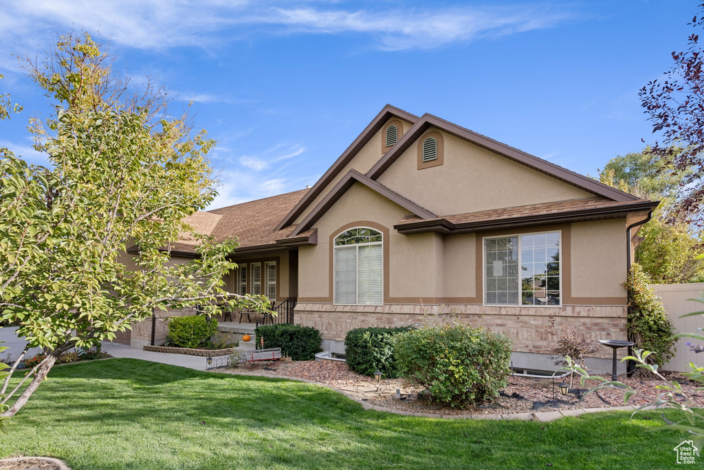 View of front of property with a front lawn