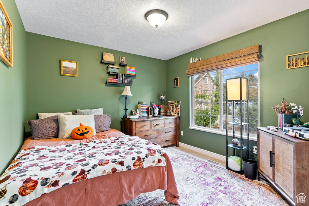 Bedroom featuring a textured ceiling