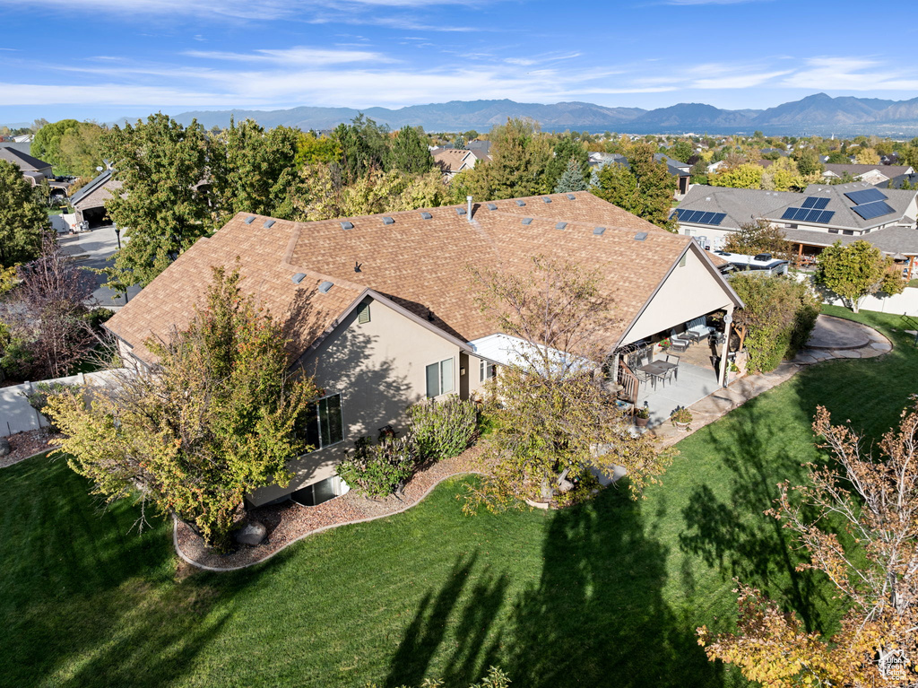 Birds eye view of property with a mountain view