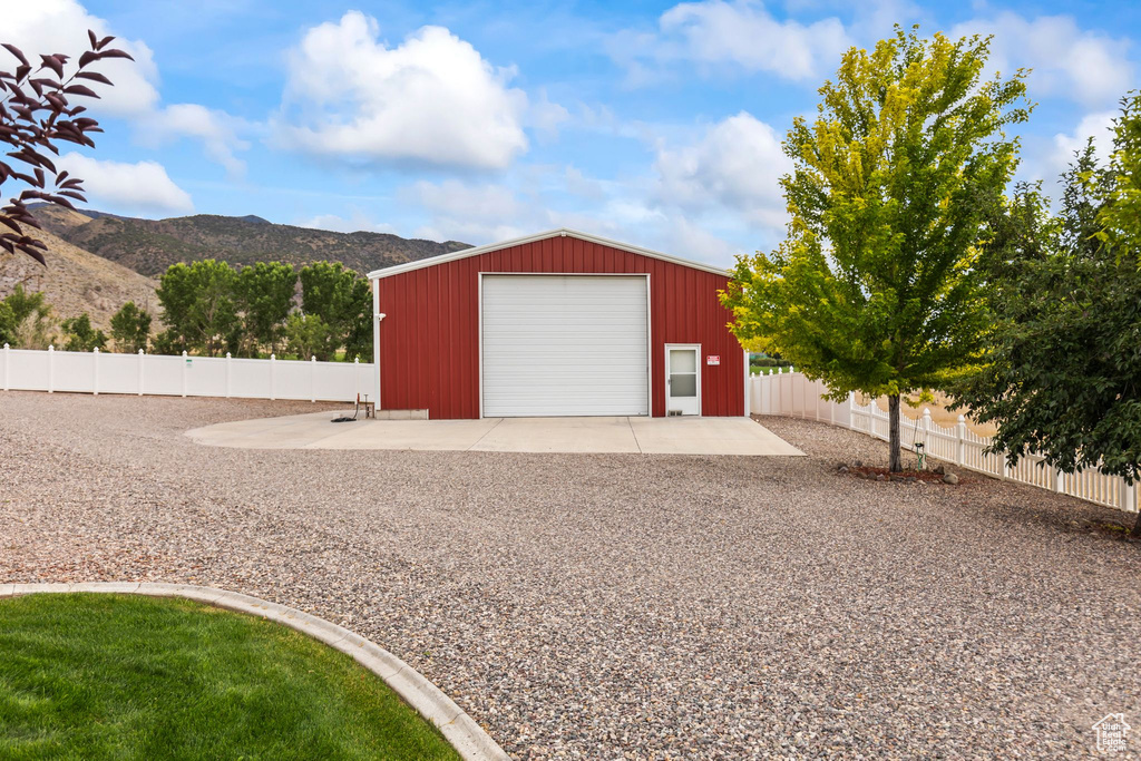 Detached garage featuring a mountain view
