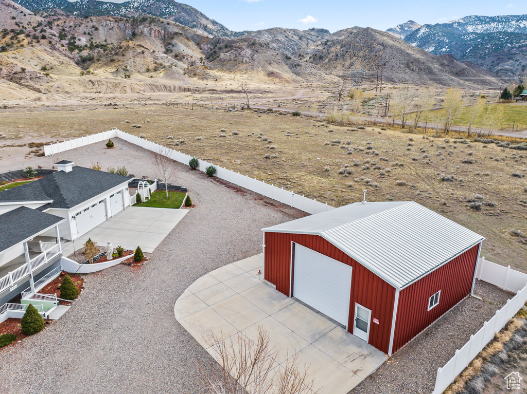 Birds eye view of property with a mountain view