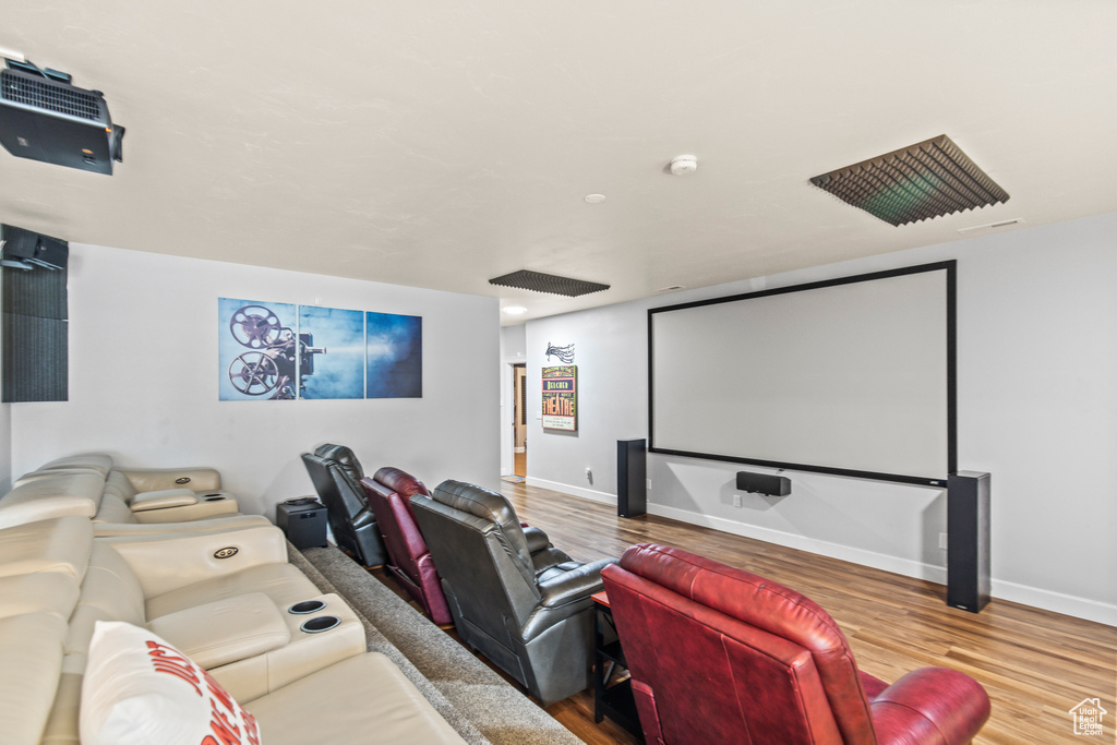 Home theater room featuring wood-type flooring