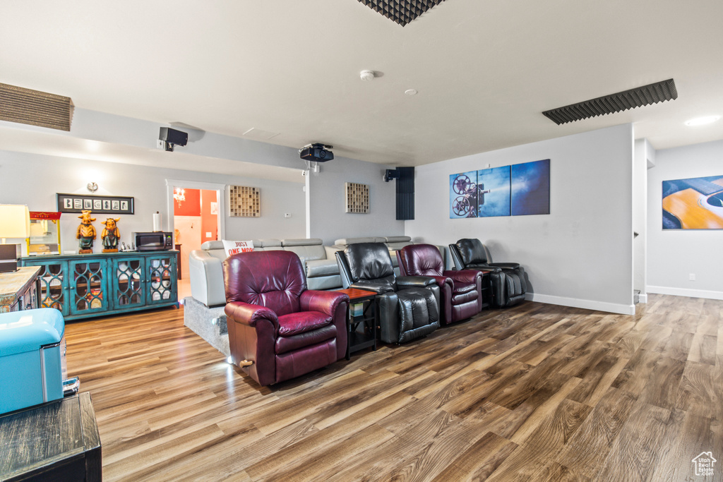 Cinema room with wood-type flooring